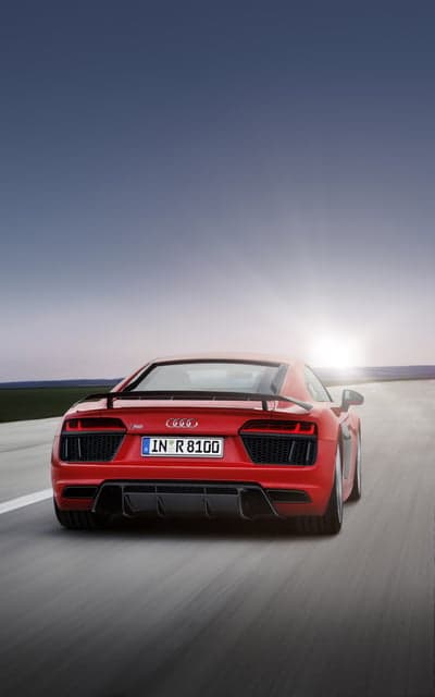 Red Audi R8 Drives into the Sunset on Highway