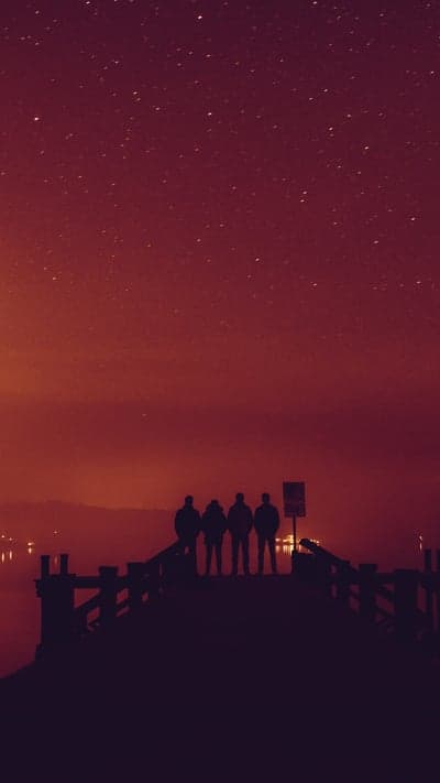 Celestial Gathering - A Silhouetted View Under the Crimson Sky