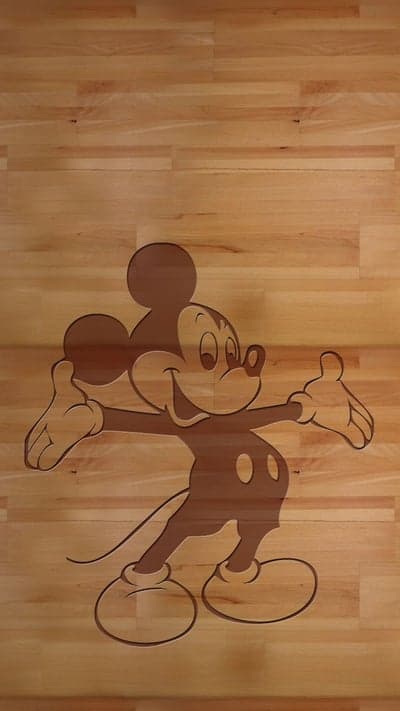 Mickey Mouse engraved on a wooden floor