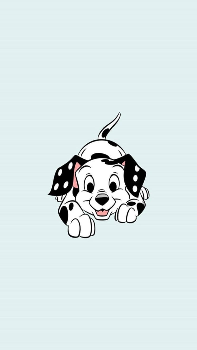 Spotted Dalmatian puppy wags its tail with a happy expression against a solid light blue background.
