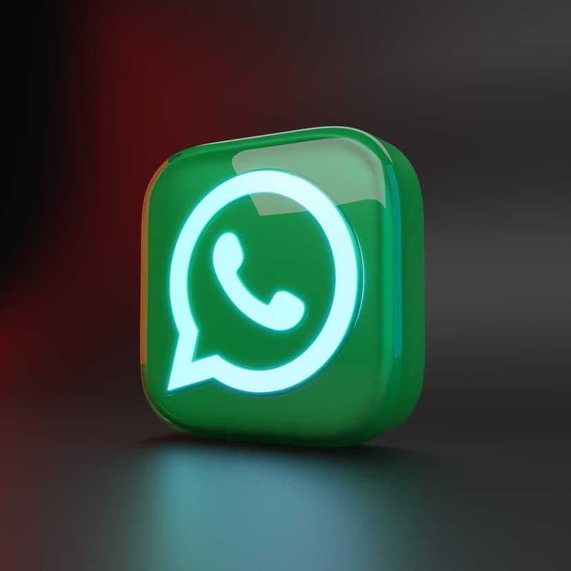 WhatsApp 3D green logo glowing with a blue neon outline on a reflective black floor with red ambient light.