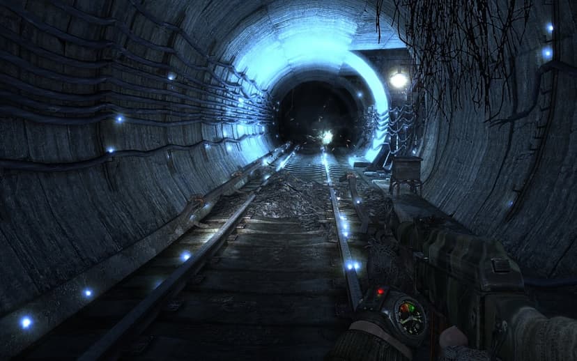 First-person view of a rifle in a dark subway tunnel with glowing blue lights along the walls and railway tracks.
