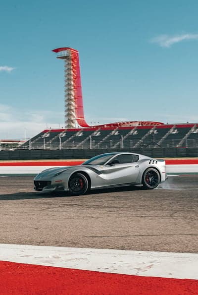 Silver Ferrari F12 TDF Circuit Action Mobile Wallpaper