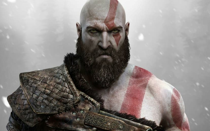 Kratos from God of War with red war paint and a thick beard wearing fur-lined leather shoulder armor.