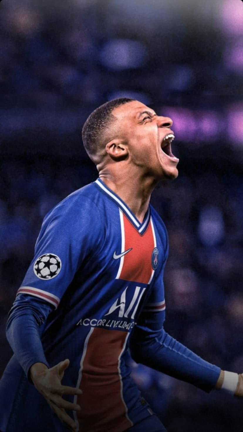 Kylian Mbappe shouts in celebration wearing a blue PSG kit with the Champions League badge on his sleeve.