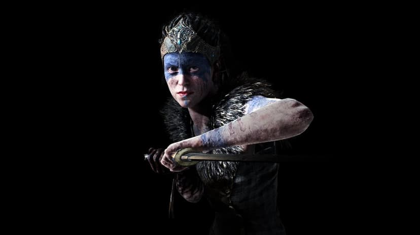 Female warrior with blue face paint and fur collar holding a sword against a solid black background in profile view.