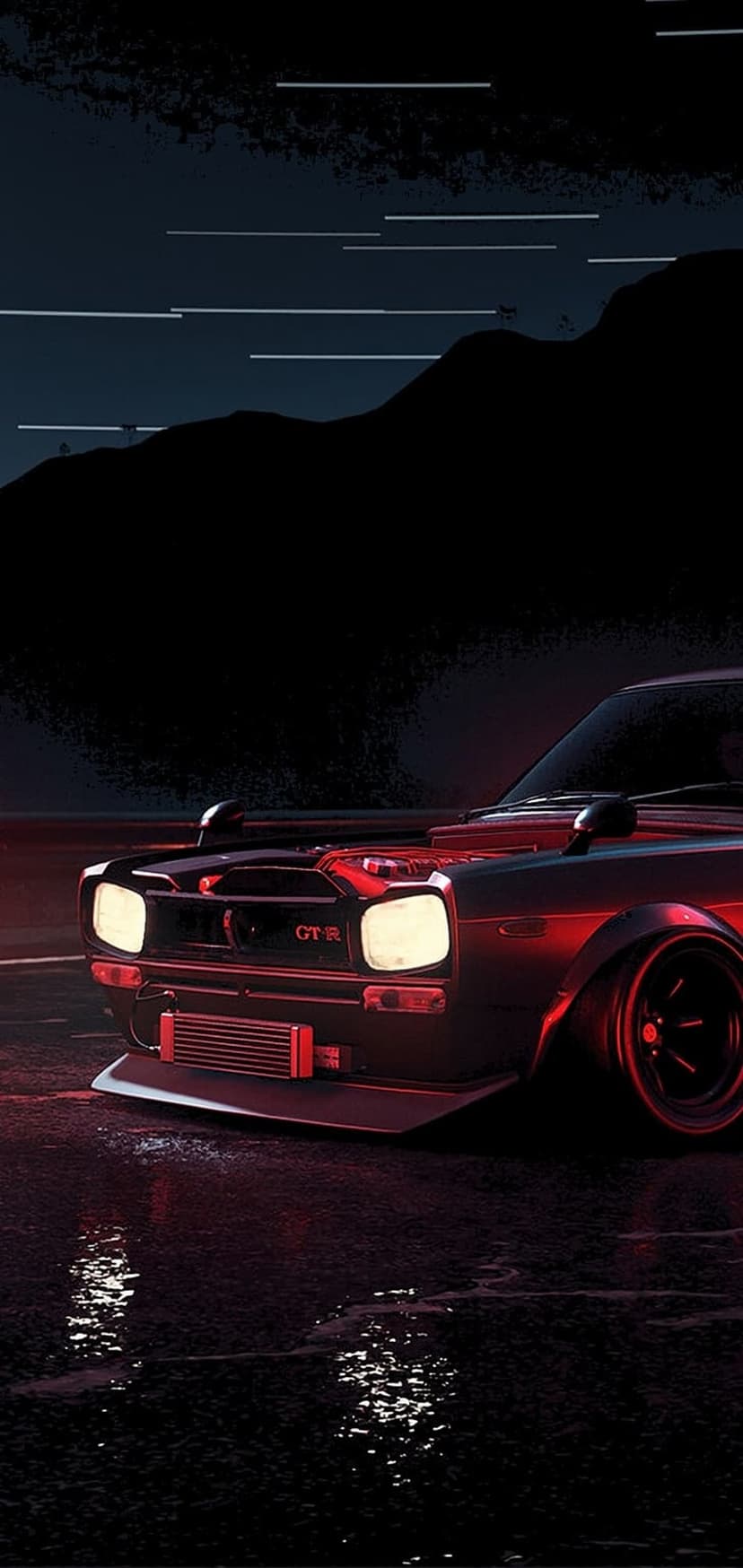 Vintage Nissan GTR with glowing headlights stands on a wet asphalt street during a dark moody rainy night.