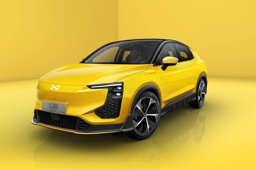 Aiways U6 yellow electric SUV in a monochromatic studio with black trim and sleek LED lighting.