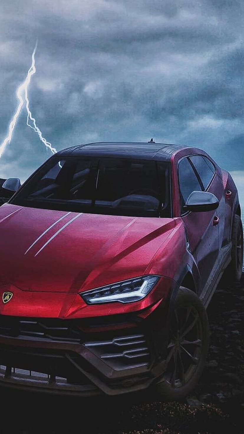 Red Lamborghini Urus SUV on a rocky ledge under a dark storm sky with a bright white lightning bolt.