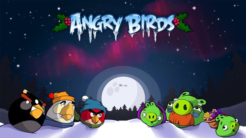 Angry Birds characters and green pigs in winter hats against a snowy night with a pink aurora and full moon.