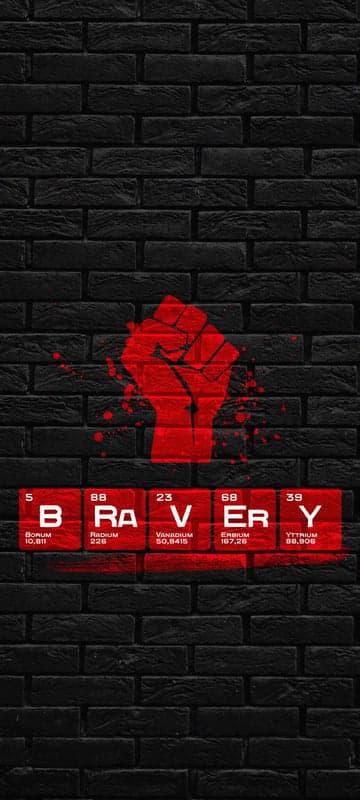 Red Fist on Black Brick Wall with BRAVERY