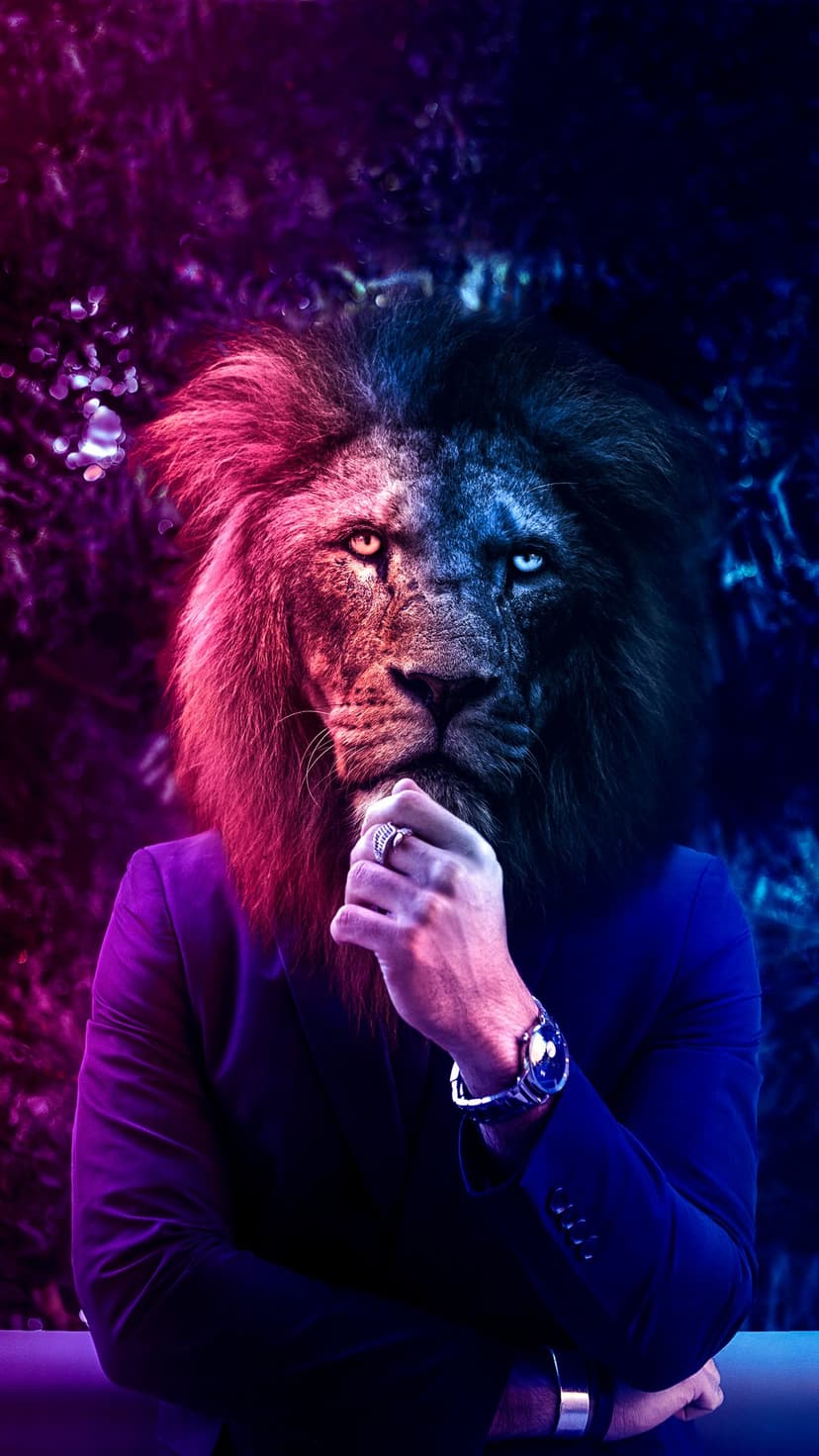 Lion man in a dark suit with a hand on his chin illuminated by neon pink and blue lights against a dark background.
