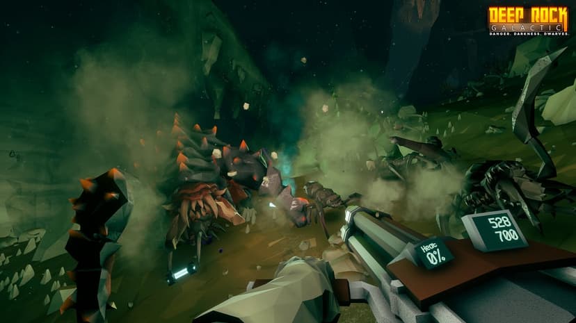 First-person view of a dwarf holding a minigun facing a large armored alien in a smoky green cave.