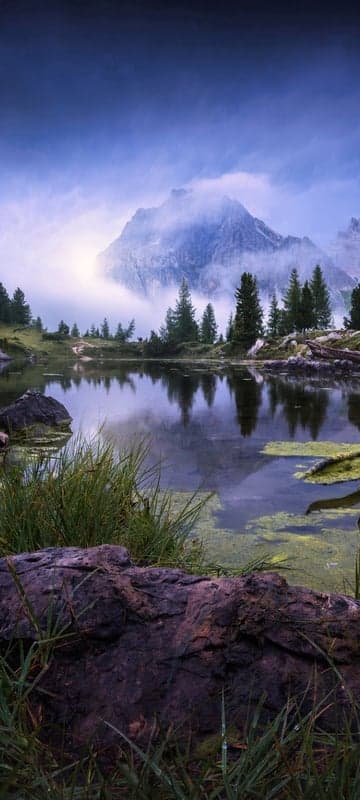 Misty Mountain Lake Reflection with Lush Greenery