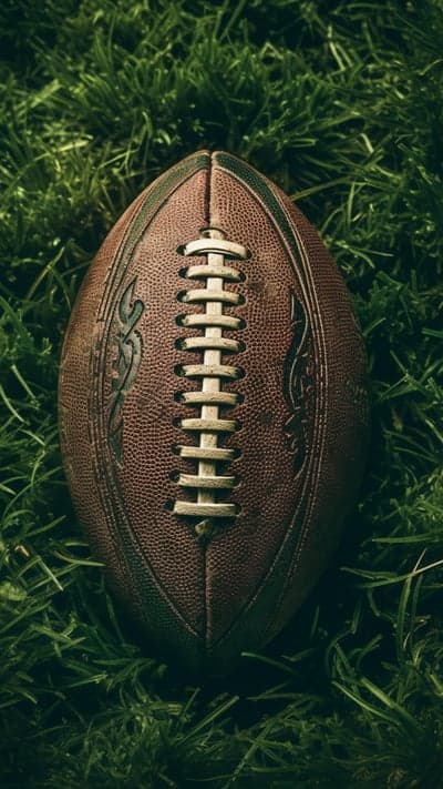 American Football on Green Grass Close-Up