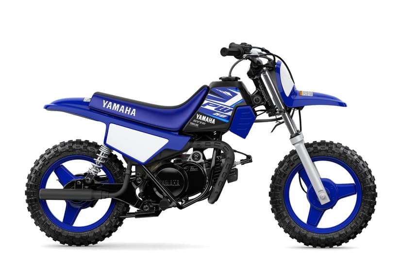 Blue Yamaha PW50 mini dirt bike with knobby tires and white fairings against a solid white background.