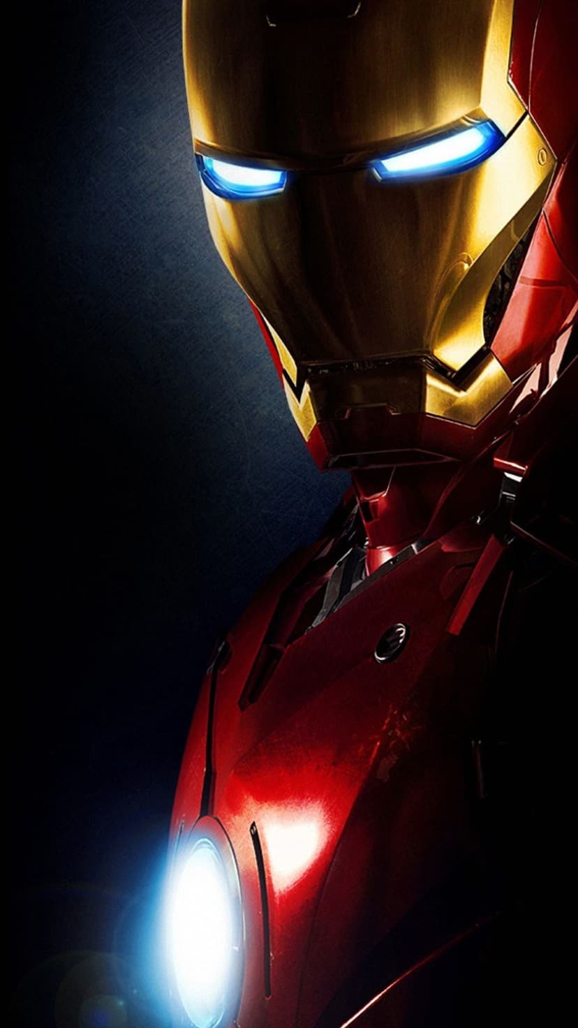 Iron Man helmet with glowing blue eyes and a crimson chest plate against a dark, moody atmospheric background.