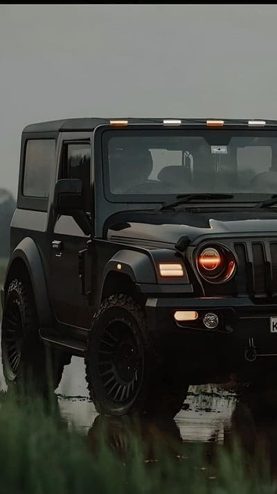 Black Mahindra Thar Off-Road SUV in Wet Terrain