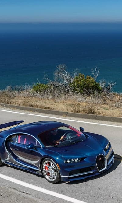 Blue Bugatti Chiron Coastal Highway Phone Wallpaper