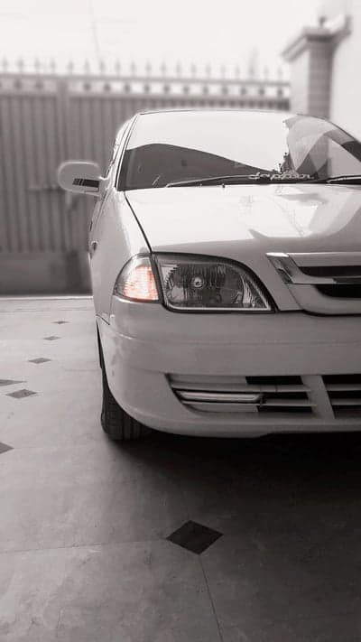 Close-up of White Car's Front Right Side and Grille