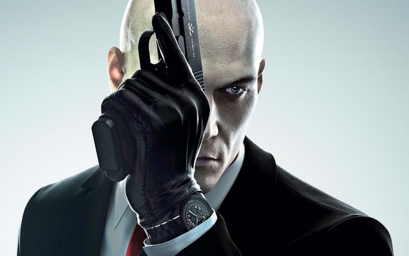 Agent 47 in a black suit holding a silenced pistol vertically against a minimalist white background.