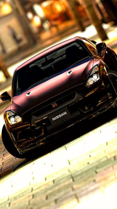 Sleek Nissan GT-R Sports Car Mobile Wallpaper in City Light
