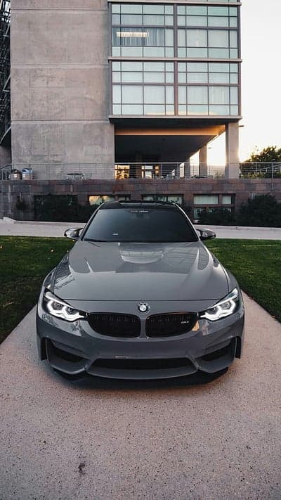 Sleek Grey BMW M4 and Architecture Mobile Wallpaper