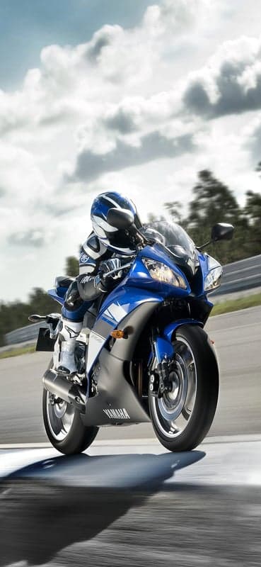 Blue Yamaha Motorcycle Rider on Track