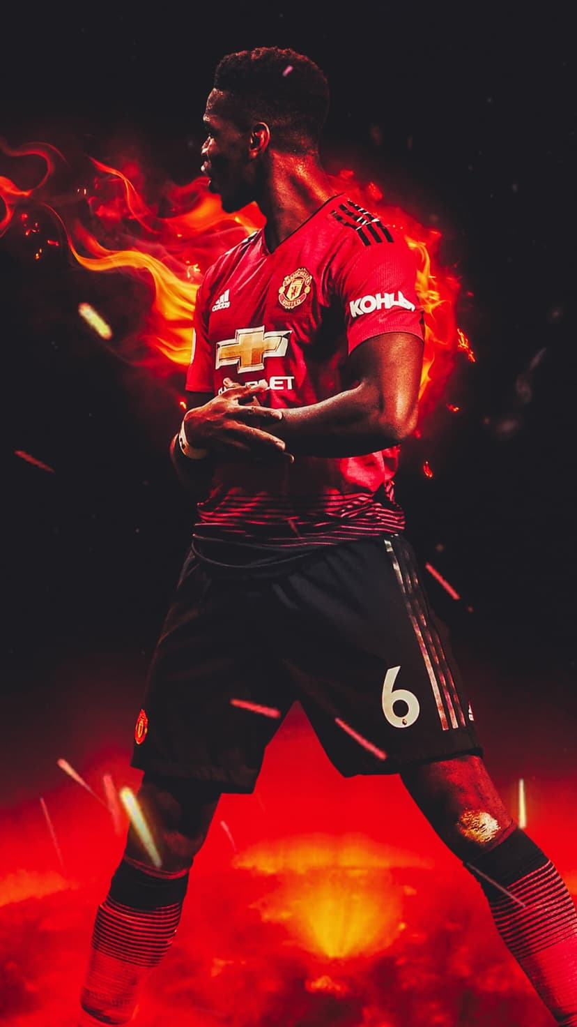 Paul Pogba in a red Manchester United jersey surrounded by swirling fire against a dark, moody background.