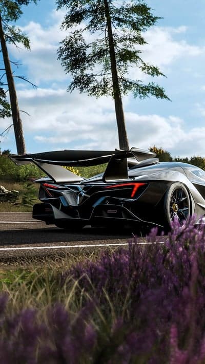 Black Performance Car Scenic Forest Road Mobile Wallpaper