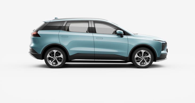 Side profile of a light blue electric SUV on a white background with silver and black alloy wheels.
