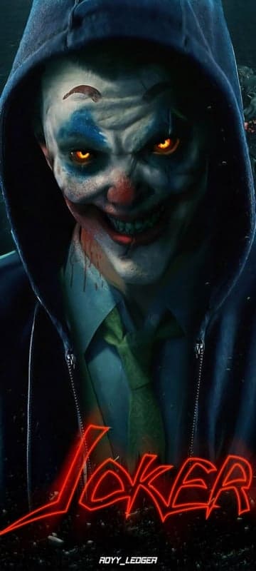 Scary Joker Clown with Glowing Eyes and Red Neon Text