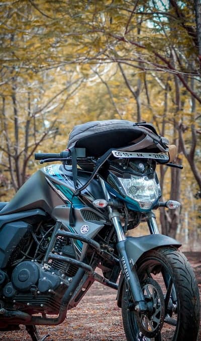 Motorcycle parked in a serene forest setting