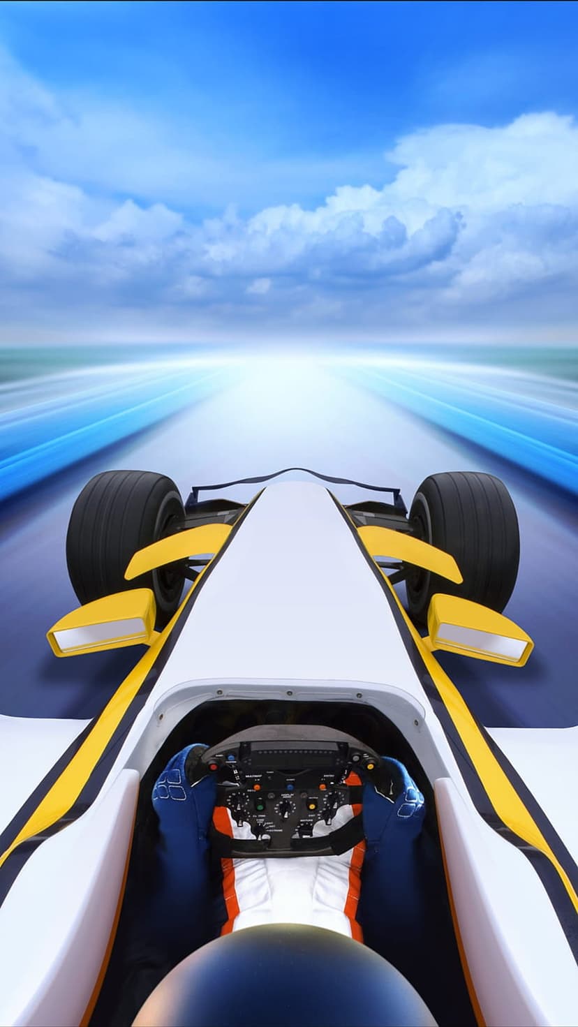F1 driver hands on a steering wheel in a white car cockpit racing on a blurred track under a cloudy sky.