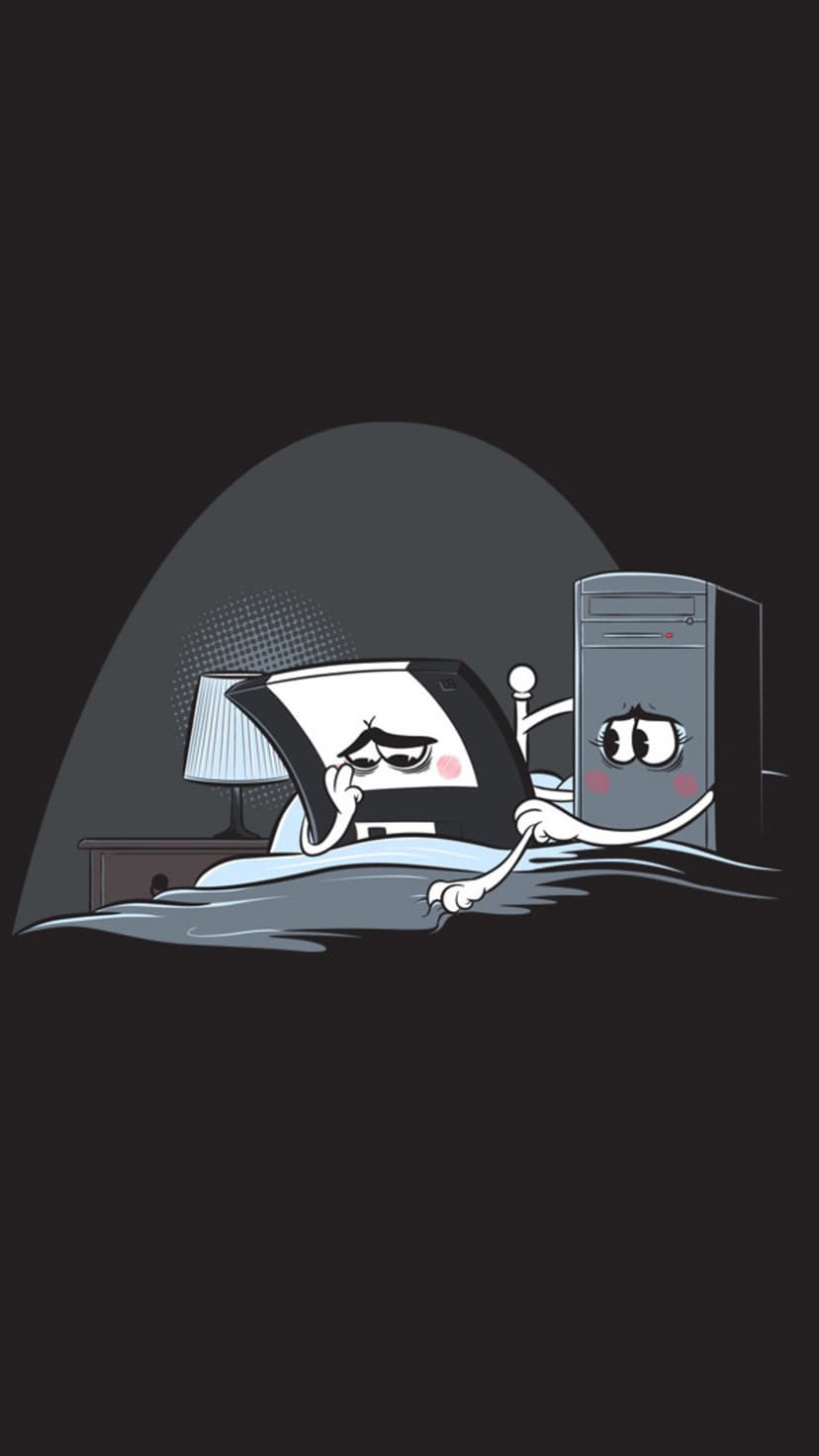 Computer tower and floppy disk resting in a bed under covers next to a glowing lamp and nightstand.