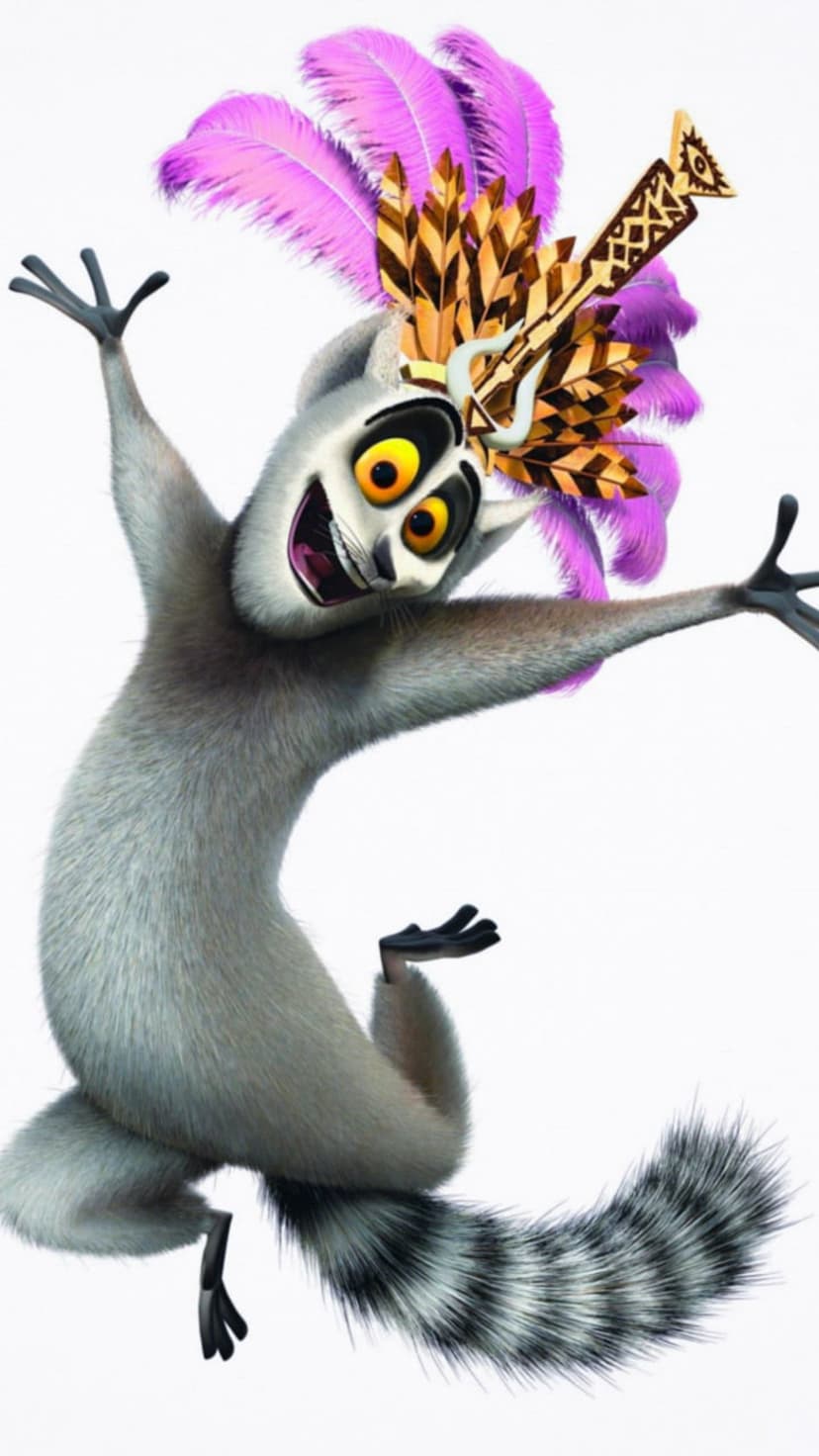 King Julien the lemur leaps with arms wide while wearing a tall purple feathered headdress on a white background.