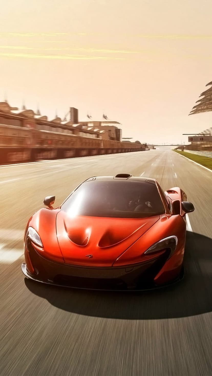 Red McLaren P1 hypercar speeds on an asphalt racetrack at sunset with motion blur and warm golden lighting.