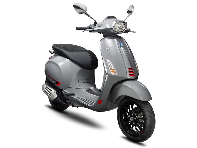 Silver Vespa Sprint S scooter with red accents and black wheels centered on a solid white background.