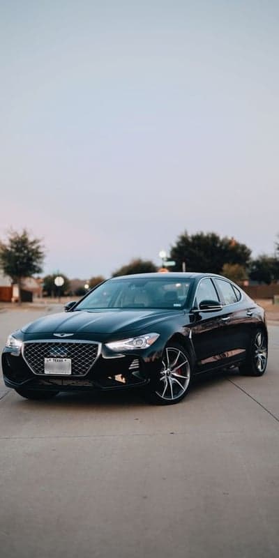 Sleek Black Genesis G70 Sedan Parked on Texas Street