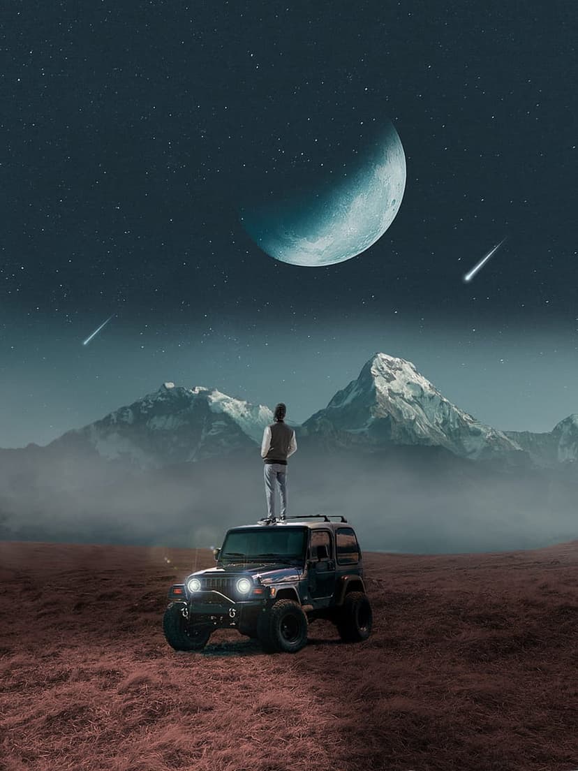 Man silhouettes atop a jeep under a crescent moon and shooting stars over misty snow-capped mountain peaks.