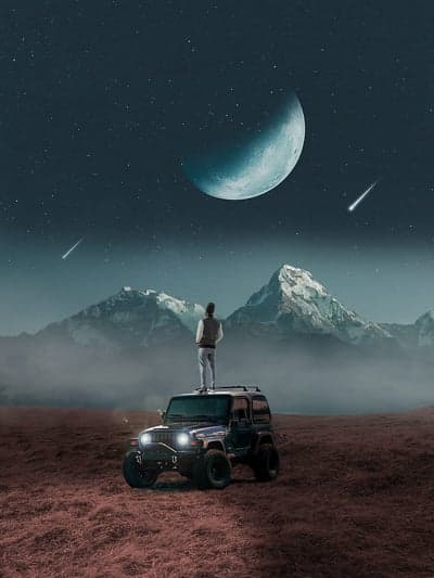 Man on Jeep Gazing at Crescent Moon and Shooting Stars