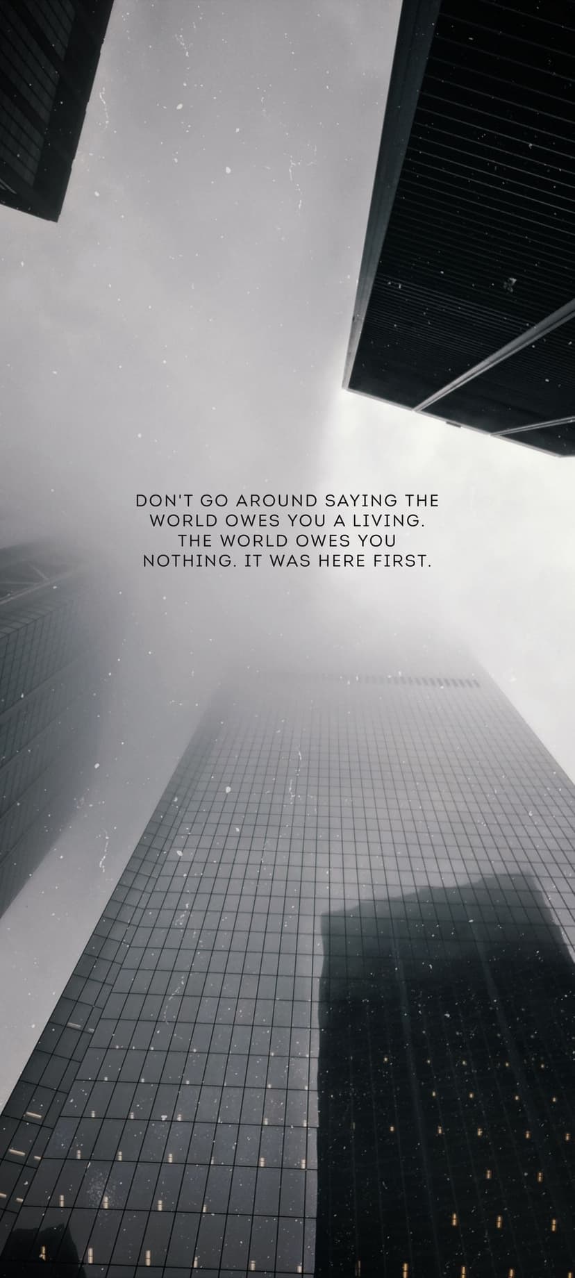 Towering skyscrapers rising into a dense fog with a text overlay about life and responsibility in monochrome.