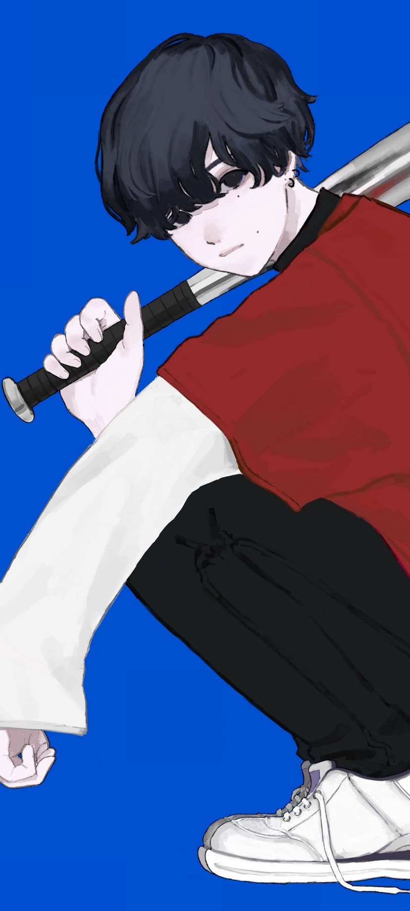 Dark-haired boy holding a baseball bat horizontally across a red shirt against a vibrant blue background.