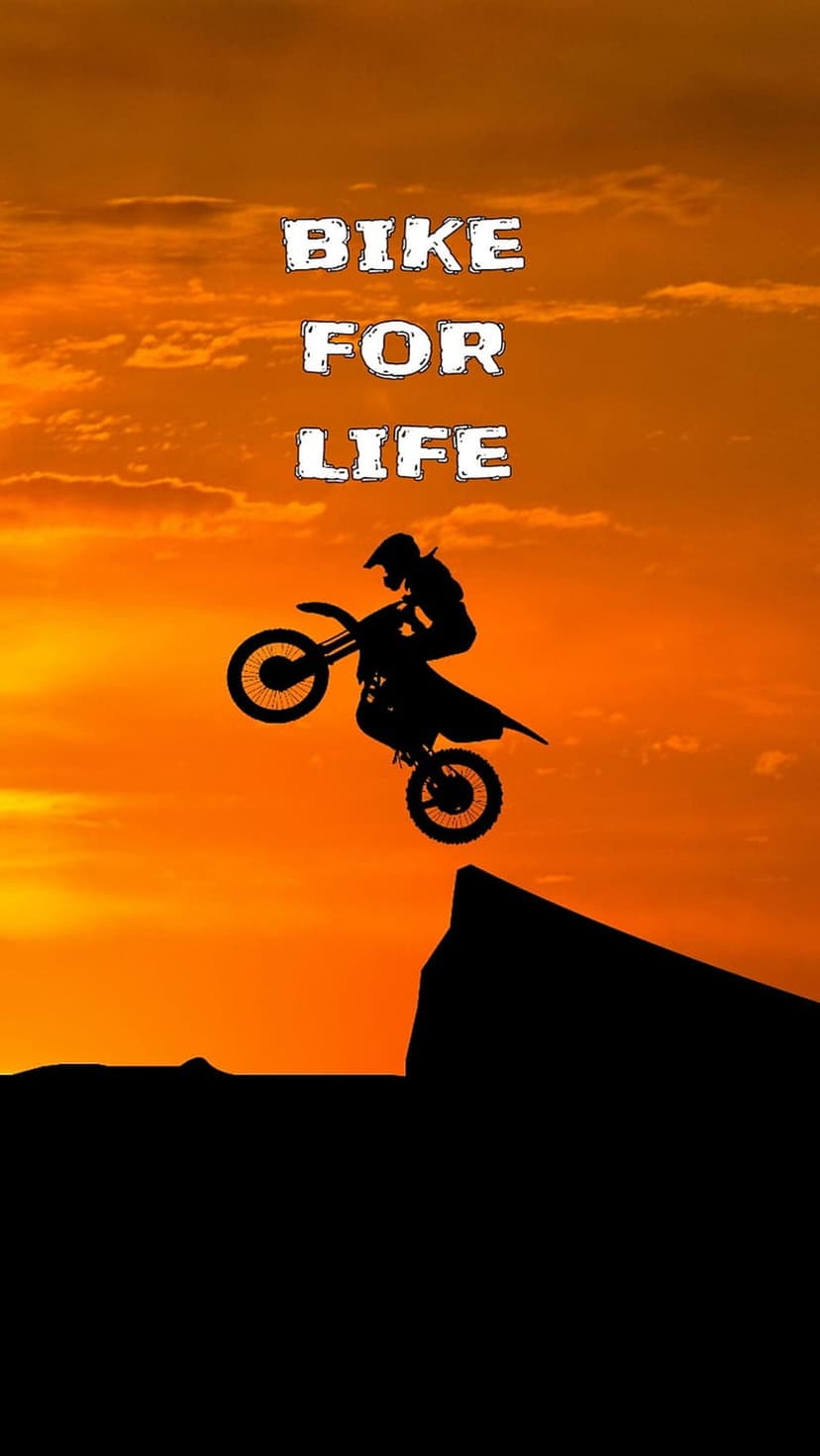 Motocross rider silhouette jumps between cliffs against a vibrant orange sunset with the text bike for life.