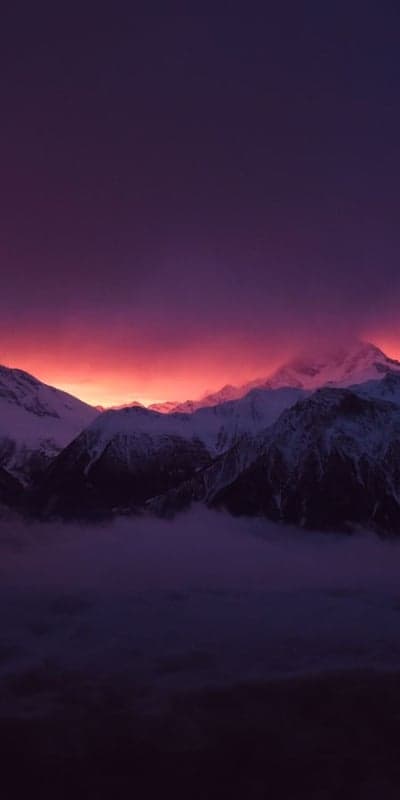 Crimson Peaks - Sunset Over Snow-Capped Mountains