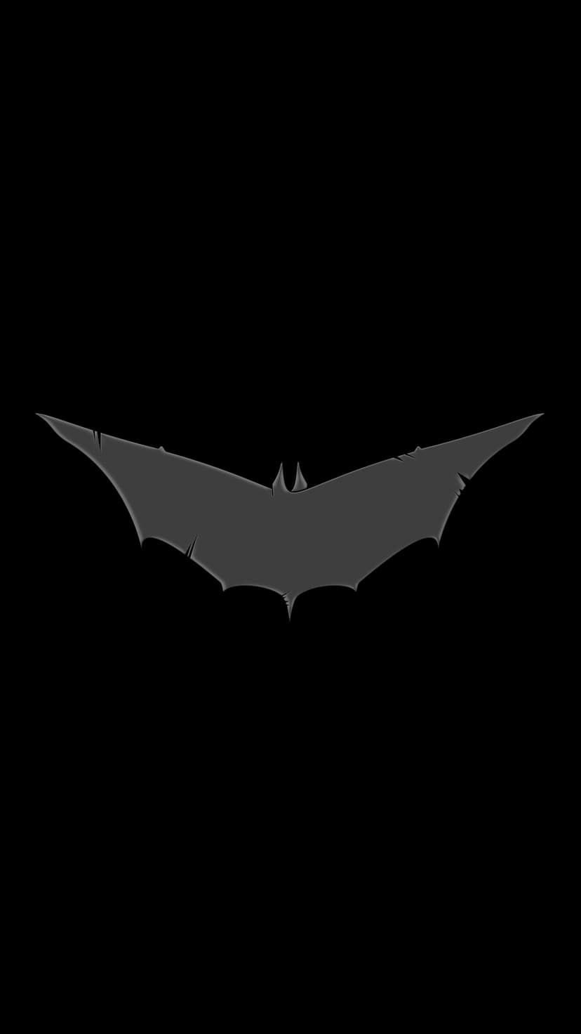Batman bat symbol with a dark gray distressed texture is centered against a solid pitch-black background.