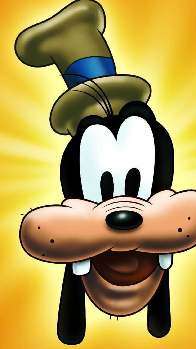 Goofy wearing a green hat smiles broadly with his eyes closed against a vibrant yellow and orange sunburst pattern.