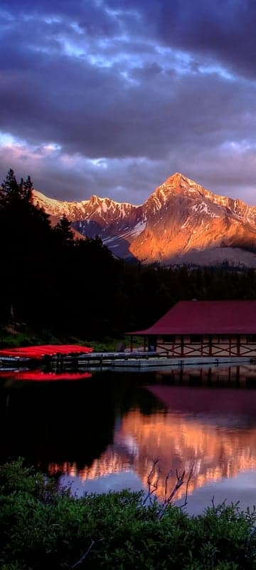Golden Mountain Peaks Reflected in Serene Lake at Sunset