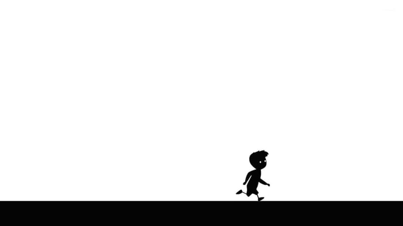 Silhouette of a small boy with glowing eyes running on a black surface against a plain white backdrop.