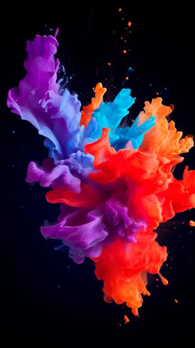 Explosion of vibrant colored ink in dark water